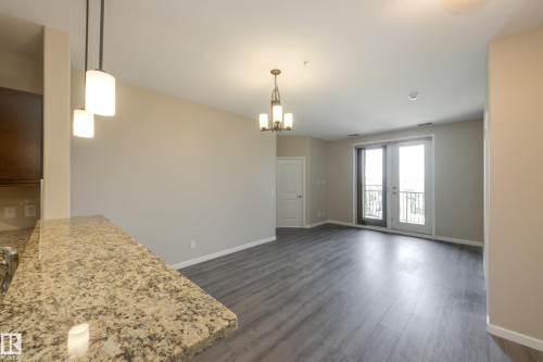 317 6083 Maynard Way, Edmonton, AB - Indoor Photo Showing Other Room