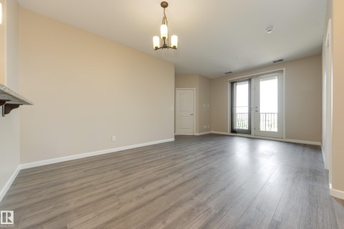 317 6083 Maynard Way, Edmonton, AB - Indoor Photo Showing Other Room