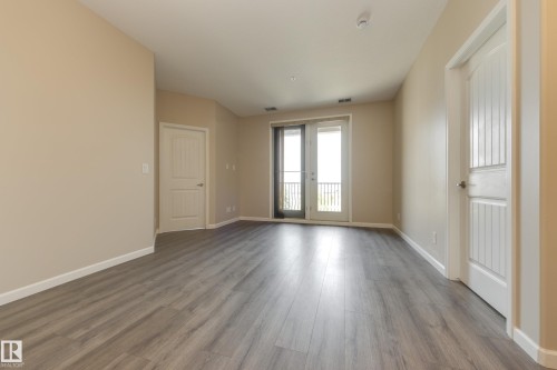 317 6083 Maynard Way, Edmonton, AB - Indoor Photo Showing Other Room