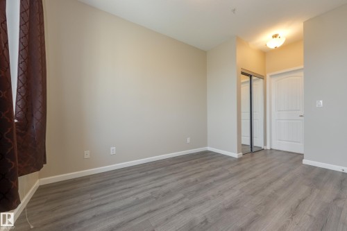 317 6083 Maynard Way, Edmonton, AB - Indoor Photo Showing Other Room