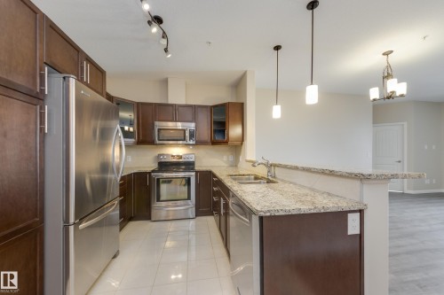317 6083 Maynard Way, Edmonton, AB - Indoor Photo Showing Kitchen With Double Sink With Upgraded Kitchen
