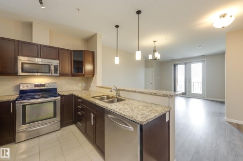 317 6083 Maynard Way, Edmonton, AB - Indoor Photo Showing Kitchen With Double Sink With Upgraded Kitchen