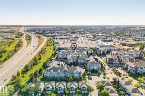 Aerial perspective highlighting the property within a developed urban landscape, featuring multi-story residential buildings with varied architectural styles - 215 2208 44 Avenue, Edmonton, AB - Outdoor With View