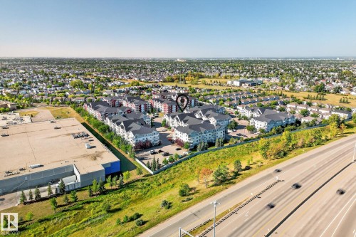 Aerial perspective showcasing residential buildings with light-colored siding and dark roofs - 215 2208 44 Avenue, Edmonton, AB - Outdoor With View