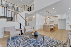 Open-concept living area featuring light wood-finish flooring throughout - 