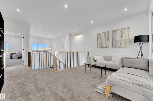 Upper-level landing featuring plush gray carpeting, white walls, and recessed lighting - 382 Linden Loop, Leduc, AB - Indoor