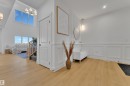 Spacious entry featuring light wood-finish flooring and wainscoting details - 382 Linden Loop, Leduc, AB  - Indoor Photo Showing Other Room 