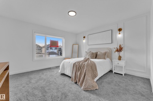 Spacious room featuring broadloom carpeting, a large window, recessed ceiling lighting, and decorative wall paneling with sconce lighting fixtures - 259 Linden Loop, Leduc, AB - Indoor Photo Showing Bedroom