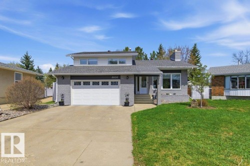 Contemporary two-story residence featuring a gray exterior finish and white trim - 8608 22 Ave, Edmonton, AB - Outdoor With Facade