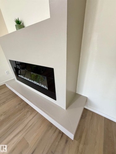 22 9703 174 Street Nw, Edmonton, AB - Indoor With Fireplace