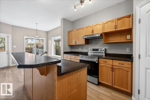 99 Birch Place, Fort Saskatchewan, AB - Indoor Photo Showing Kitchen With Double Sink