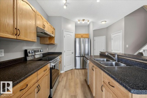 99 Birch Place, Fort Saskatchewan, AB - Indoor Photo Showing Kitchen With Double Sink