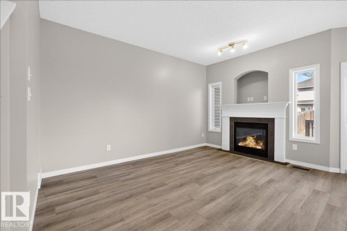 99 Birch Place, Fort Saskatchewan, AB - Indoor Photo Showing Living Room With Fireplace