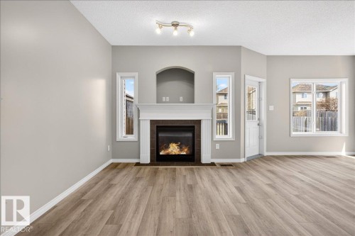 99 Birch Place, Fort Saskatchewan, AB - Indoor Photo Showing Living Room With Fireplace