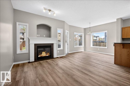 99 Birch Place, Fort Saskatchewan, AB - Indoor Photo Showing Living Room With Fireplace