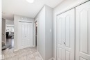 Entryway with light-toned tiled flooring and baseboards - 6419 18 Ave Sw, Edmonton, AB  - Indoor Photo Showing Other Room 