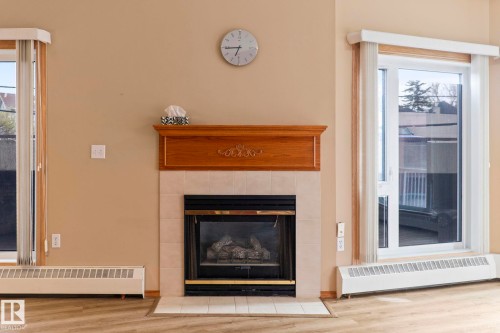 206 10809 Saskatchewan Drive Nw, Edmonton, AB - Indoor Photo Showing Living Room With Fireplace
