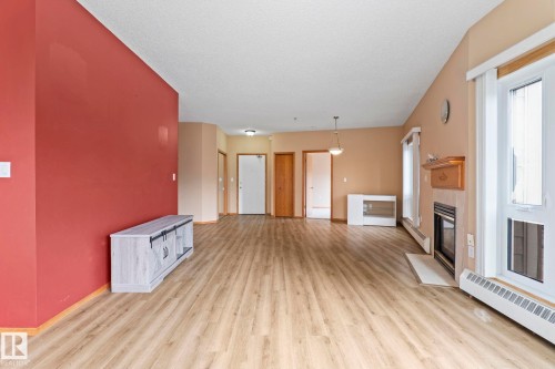 206 10809 Saskatchewan Drive Nw, Edmonton, AB - Indoor Photo Showing Other Room With Fireplace