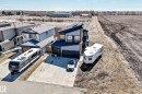 Modern two-story residence featuring a striking multi-toned exterior with dark and light siding accents - 5263 47 Ave, Calmar, AB 