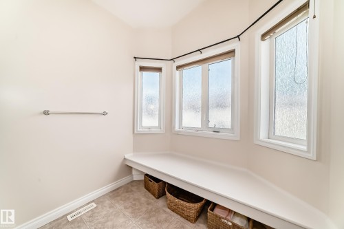 Corner window seating with integrated storage space - 40 13808 155 Avenue, Edmonton, AB - Indoor Photo Showing Other Room