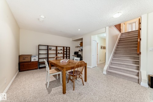 Carpeted lower level featuring a light beige color palette - 40 13808 155 Avenue, Edmonton, AB - Indoor