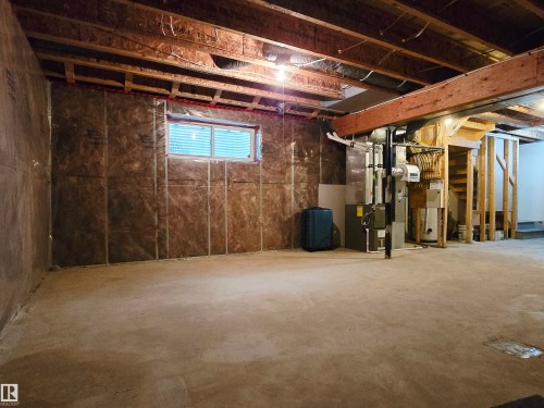Unfinished basement with exposed ceiling joists and concrete flooring - 21321 94 Avenue, Edmonton, AB - Indoor Photo Showing Basement