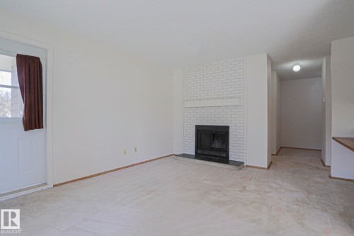 101 60 Alpine Place, St. Albert, AB - Indoor Photo Showing Living Room With Fireplace