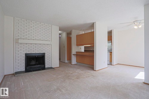 101 60 Alpine Place, St. Albert, AB - Indoor Photo Showing Living Room With Fireplace