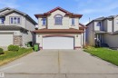 Two-story residence featuring light-colored siding with contrasting trim - 16204 48 Street, Edmonton, AB  - Outdoor With Facade 