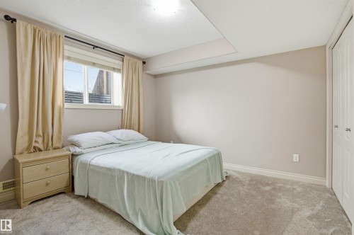 Carpeted room with neutral wall tones and a single window - 16204 48 Street, Edmonton, AB - Indoor Photo Showing Bedroom