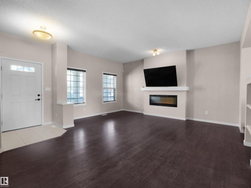 7766 Eifert Crescent, Edmonton, AB - Indoor Photo Showing Living Room With Fireplace