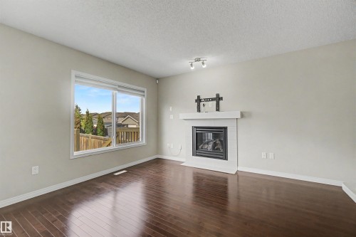 2534 Coughlan Road, Edmonton, AB - Indoor Photo Showing Living Room With Fireplace