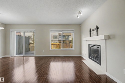 2534 Coughlan Road, Edmonton, AB - Indoor Photo Showing Living Room With Fireplace