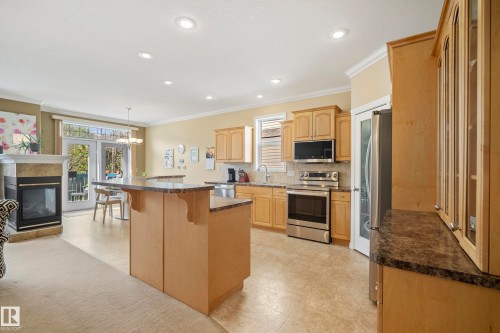 2332 Rutherford Way, Edmonton, AB - Indoor Photo Showing Kitchen With Fireplace With Stainless Steel Kitchen