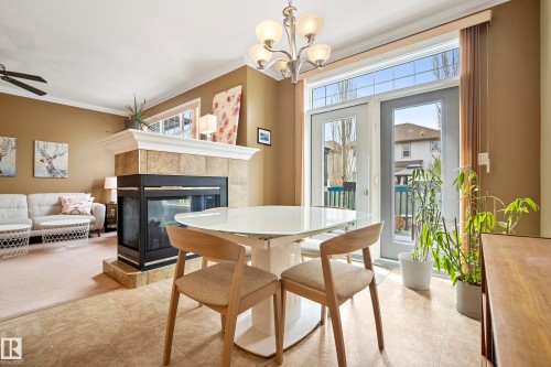 2332 Rutherford Way, Edmonton, AB - Indoor Photo Showing Dining Room With Fireplace