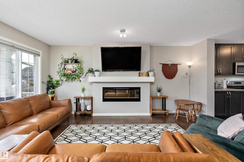 8324 23 Avenue, Edmonton, AB - Indoor Photo Showing Living Room With Fireplace