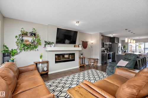 8324 23 Avenue, Edmonton, AB - Indoor Photo Showing Living Room With Fireplace