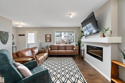 8324 23 Avenue, Edmonton, AB - Indoor Photo Showing Living Room With Fireplace