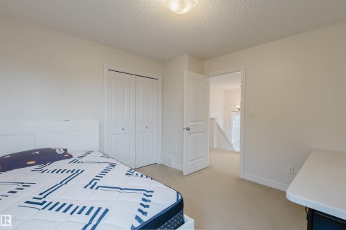 Neutral wall paint with carpet flooring - 17718 5A Avenue, Edmonton, AB - Indoor Photo Showing Bedroom