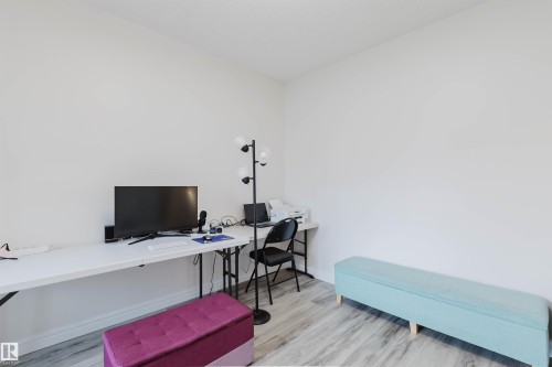 Room featuring light wood-finish flooring and white walls - 17718 5A Avenue, Edmonton, AB - Indoor