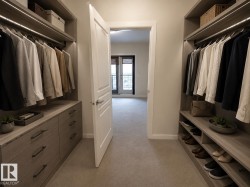 Staged image showcasing potential organizational ideas for the walk-in-closet - 