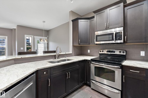 5 Gilmore Way, Spruce Grove, AB - Indoor Photo Showing Kitchen With Stainless Steel Kitchen With Double Sink With Upgraded Kitchen