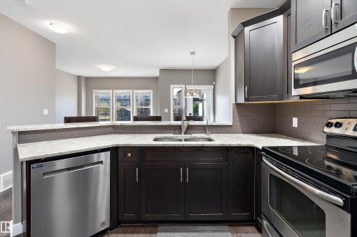 5 Gilmore Way, Spruce Grove, AB - Indoor Photo Showing Kitchen With Stainless Steel Kitchen With Double Sink