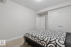 Room featuring light neutral wall paint and white trim - 