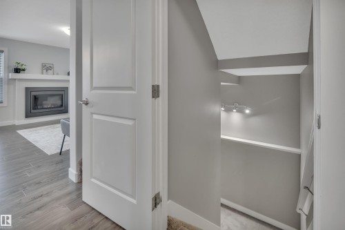 194 Sturtz Bend, Leduc, AB - Indoor Photo Showing Other Room With Fireplace