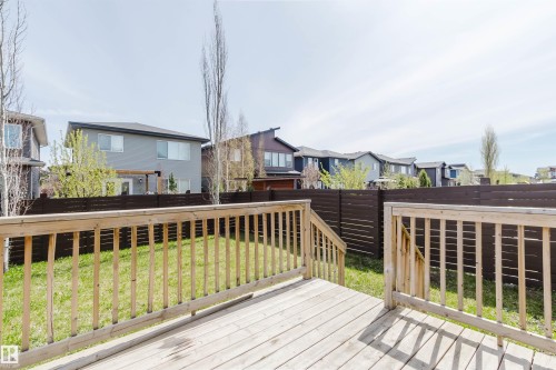 Spacious wooden deck overlooking a private yard with a horizontal slatted fence - 2839 Koshal Crescent, Edmonton, AB - Outdoor With Deck Patio Veranda