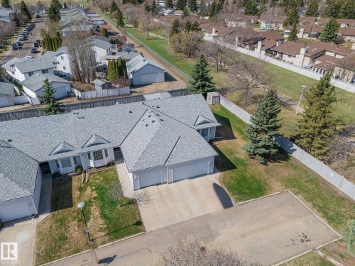 Aerial perspective showcasing a residential property with a light gray shingle roof and a two-car garage - 25 1904 Mill Woods Road Road, Edmonton, AB - Outdoor