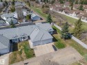 Aerial perspective showcasing a residential property with a light gray shingle roof and a two-car garage - 25 1904 Mill Woods Road Road, Edmonton, AB  - Outdoor 