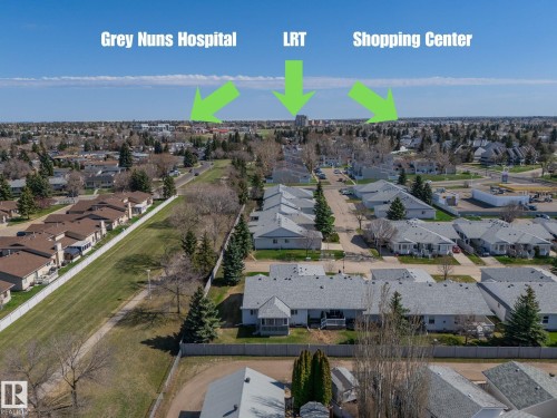 Aerial perspective showcasing a residential area with varied rooflines and surrounding green spaces - 25 1904 Mill Woods Road Road, Edmonton, AB - Outdoor With View