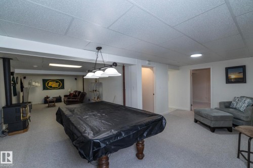 Finished lower level with drop ceiling, recessed lighting, and light-toned carpeting - 25 1904 Mill Woods Road Road, Edmonton, AB - Indoor Photo Showing Other Room